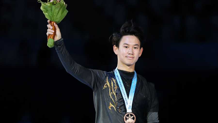 Bronze medalist Denis Ten of Kazakhstan looks on in the victory ceremony for men free skating during the 2017 Shanghai Trophy at the Oriental Sports Center on November 25, 2017 in Shanghai, China.