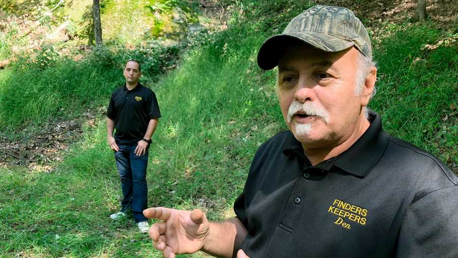 Dennis Parada and Kem Parada stand at the site of the FBI's dig for Civil War-era gold in Dents Run, Pa. (Sept. 2018)