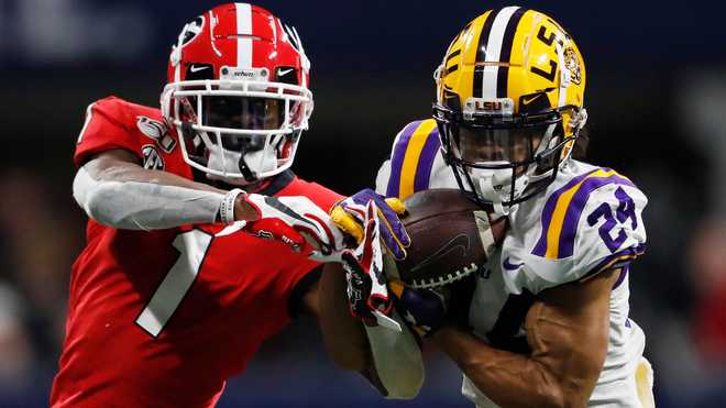 In this Dec. 7, 2019, file photo, LSU cornerback Derek Stingley  x20;Jr. (24) intercepts the ball from Georgia wide receiver George  x20;Pickens (1) during the second half of the Southeastern Conference  championship NCAA college football game, in Atlanta. Stingley was selected to The  x20;Associated Press All-America team, Monday, Dec. 16, 2019.