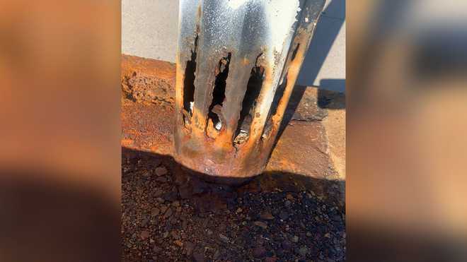 This photo obtained by 5 Investigates shows a light post on the Evelyn&# x20; x20;Moakley Bridge in Boston Seaport District which is heavily rusted&#​​x20;and&# x20; deteriorated at the base.