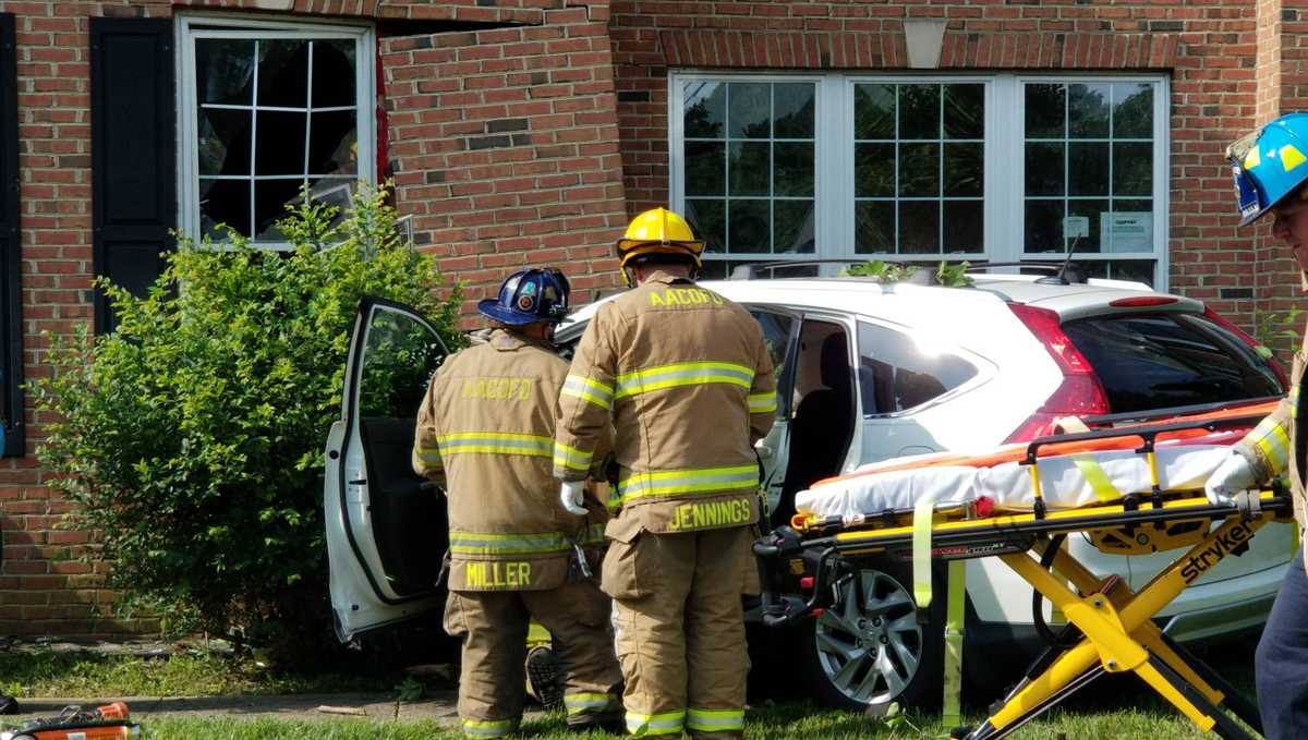 Teenage driver extricated after crashing into house