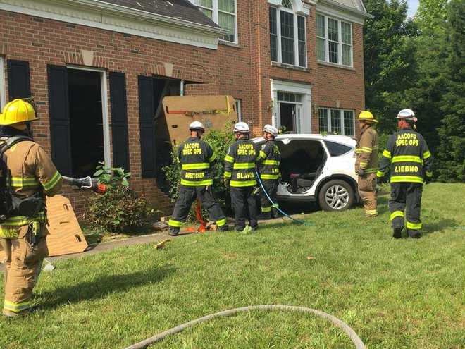Teenage driver extricated after crashing into house