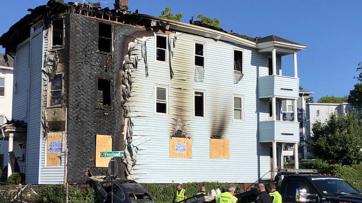 Car crashes into triple-decker, lights building on fire