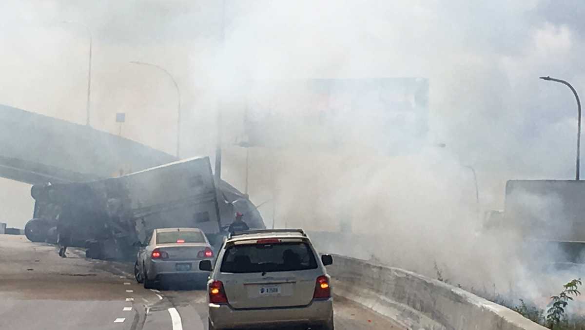 Overturned semi on SB I-71 near SB I-65 ramp ignites grass fire