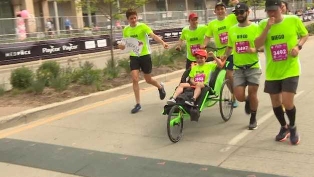 Boy battling rare disease pushes through to finish Flying Pig - Vimarsana News