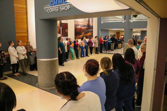 staff&#x20;members&#x20;line&#x20;the&#x20;hall&#x20;as&#x20;a&#x20;lewiston&#x20;shooting&#x20;victim&#x20;is&#x20;released&#x20;on&#x20;nov.&#x20;13