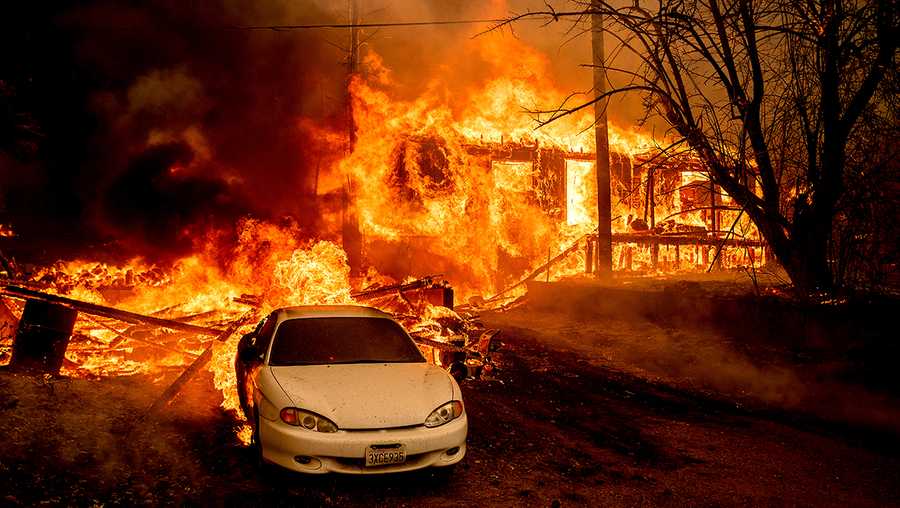 Flames from the Dixie Fire consume a home on Highway 89 south of Greenville on Thursday, Aug. 5, 2021, in Plumas County, Calif.