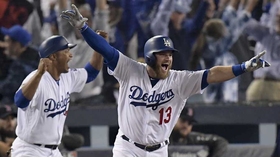 Los Angeles Dodgers' Max Muncy celebrates his walk off home run against the Boston Red Sox during the 18th inning in Game 3 of the World Series baseball game on Saturday, Oct. 27, 2018, in Los Angeles.