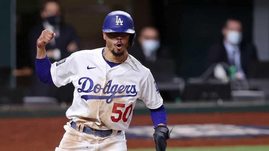 Mookie Betts #50 of the Los Angeles Dodgers celebrates after scoring a run against the Tampa Bay Rays during the sixth inning in Game Six of the 2020 MLB World Series at Globe Life Field on October 27, 2020 in Arlington, Texas.