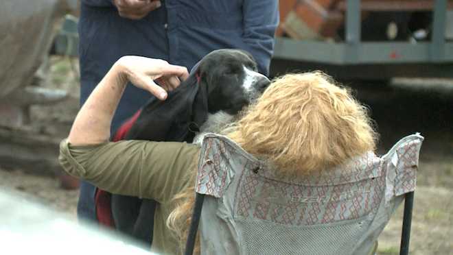 Woman reunited with dog that she thought had died in house fire