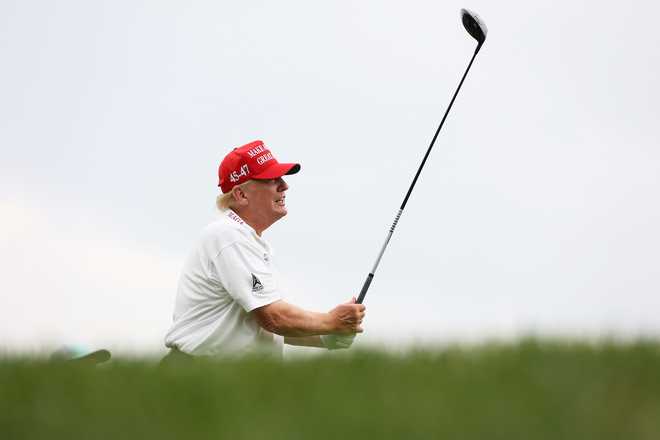 Former President Donald Trump hits his shot from the second tee during the pro-am prior to the LIV Golf Invitational - Bedminster at Trump National Golf Club on Aug. 10, 2023, in Bedminster, New Jersey.