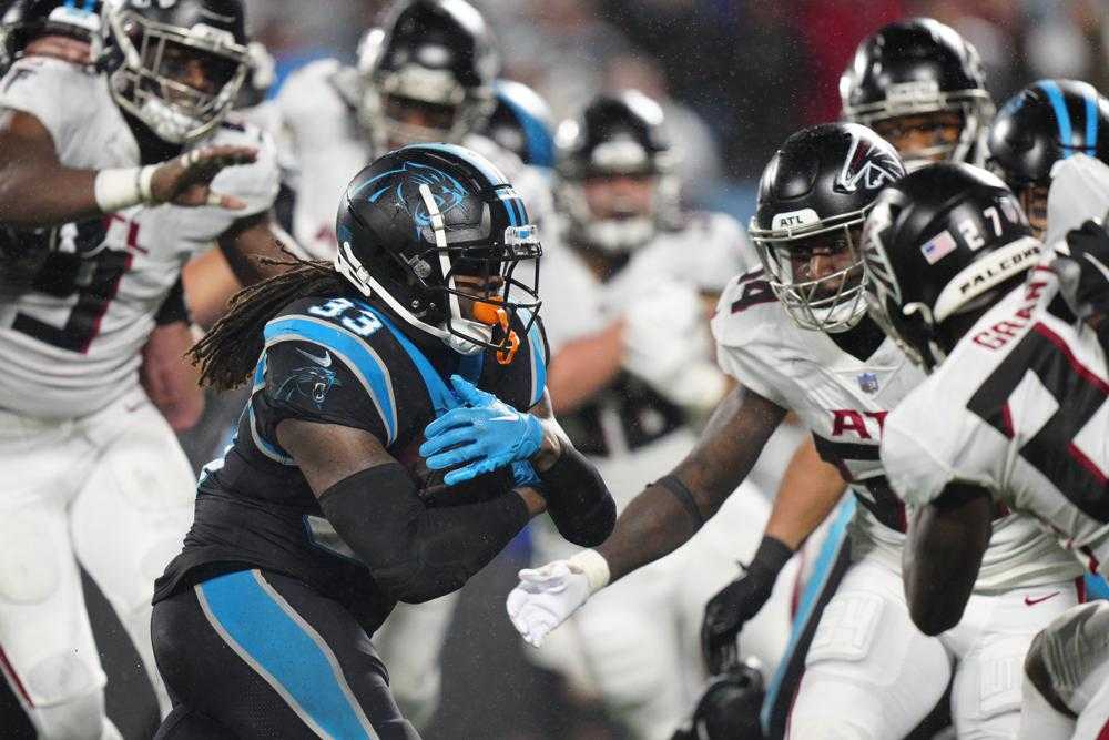 Foreman Leads Panthers Past Rival Falcons In Rain, 25-15