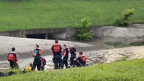 Dive team searching for boy and two men in Milwaukee drainage ditch