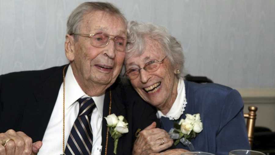 This Sept. 24, 2011 photo provided by Elizabeth Officer shows her grandparents Gilbert Orzell Drake and Evelyn Bennett Drake at the Albany Country Club in Albany, N.Y. The couple, born two years and two days apart and married 78 years, has died within two days of each other. According to their family, 98-year-old Evelyn died July 20, 2018, and her 100-year-old husband Gilbert passed away two days later. Both died of natural causes with their family by their sides at the couple's home in Delmar, an Albany suburb.