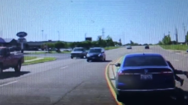 Dramatic video: Man jumps into moving car to save driver having seizure