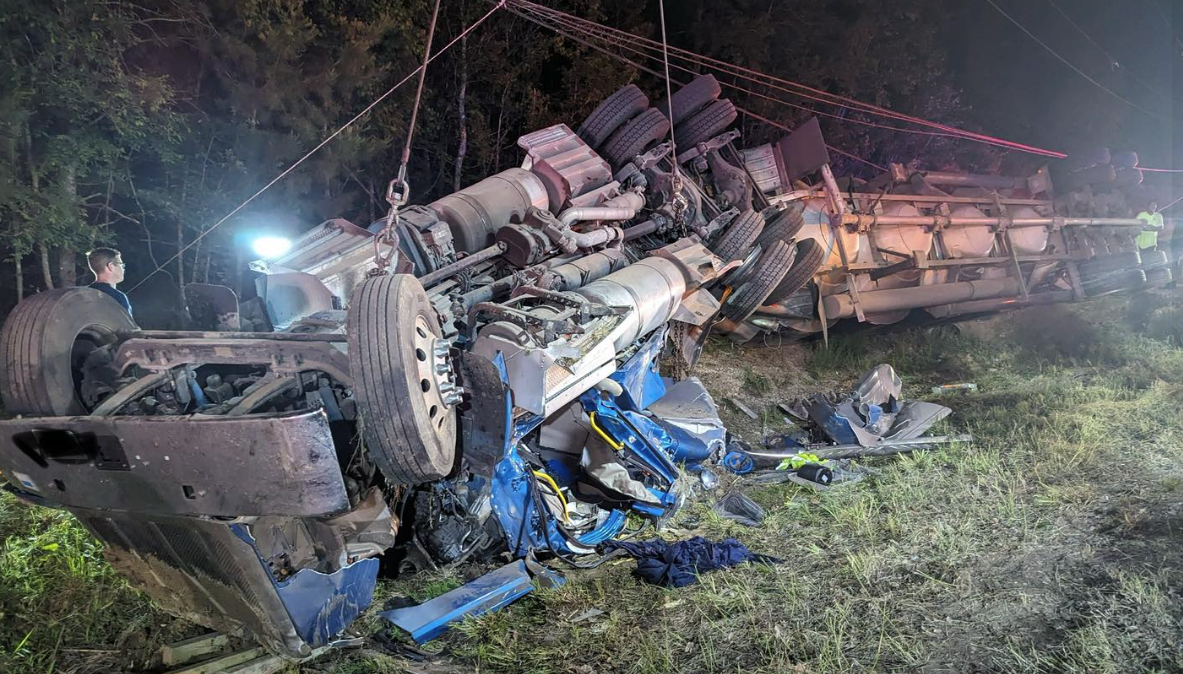 Driver freed after spending 3 hours inside overturned truck
