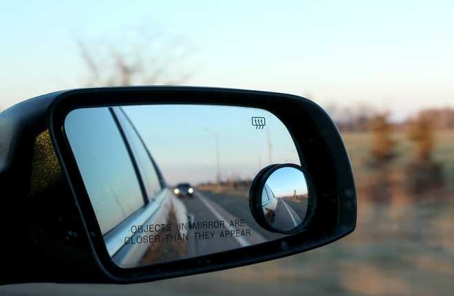 Drivers just realizing they've been using their rearview mirror wrong - a  secret tab stops headlights from blinding you