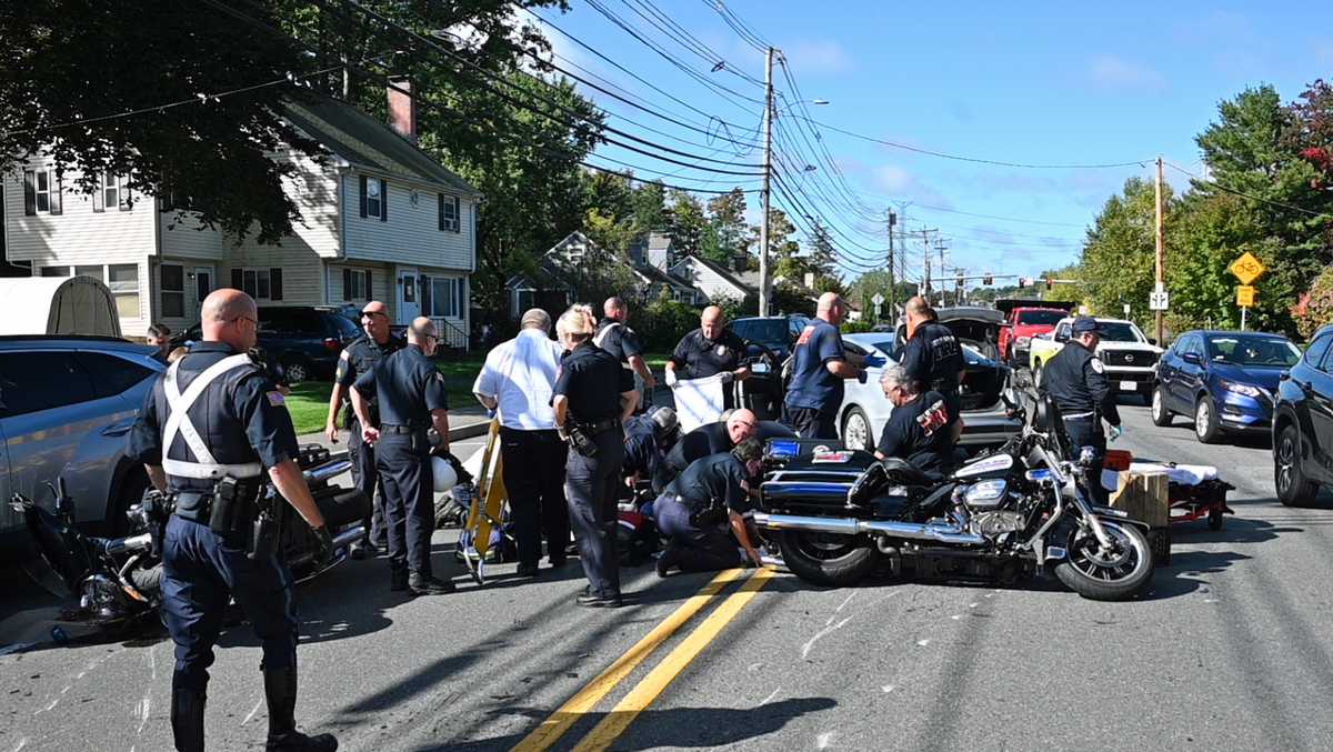 2 police motorcycles crash during funeral escort