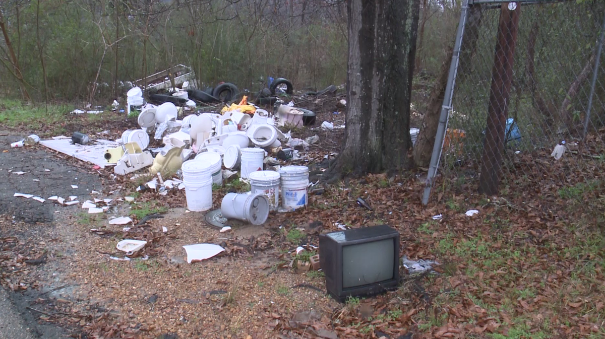 Jackson crews clean a growing illegal dumping site