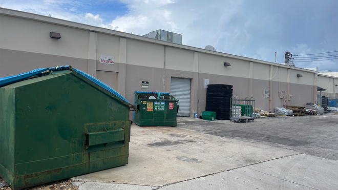 Dumpster at Vision Ace Hardware store in Cape Coral