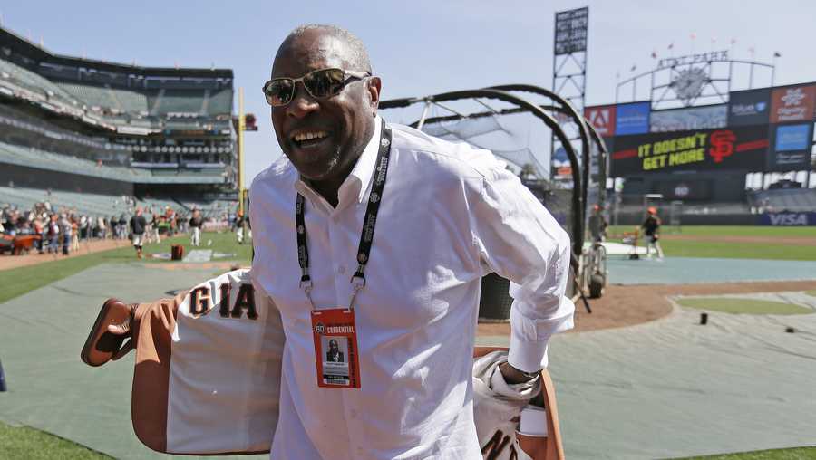 FILE -  In this April 3, 2018, file photo, former manager Dusty Baker shows off the lining of his sport coat before the start of an opening day baseball game between the San Francisco Giants and the Seattle Mariners in San Francisco. Baker lost his job with Washington after last season, when he guided the Nationals to a second straight NL East title. It has been a blessing of sorts. Baker never forgets to remind himself of his good fortune, even during the down times in his big league baseball career spanning a half-century. Sure, he still wants to manage and go out on his own terms when the time comes. (AP Photo/Eric Risberg, File)