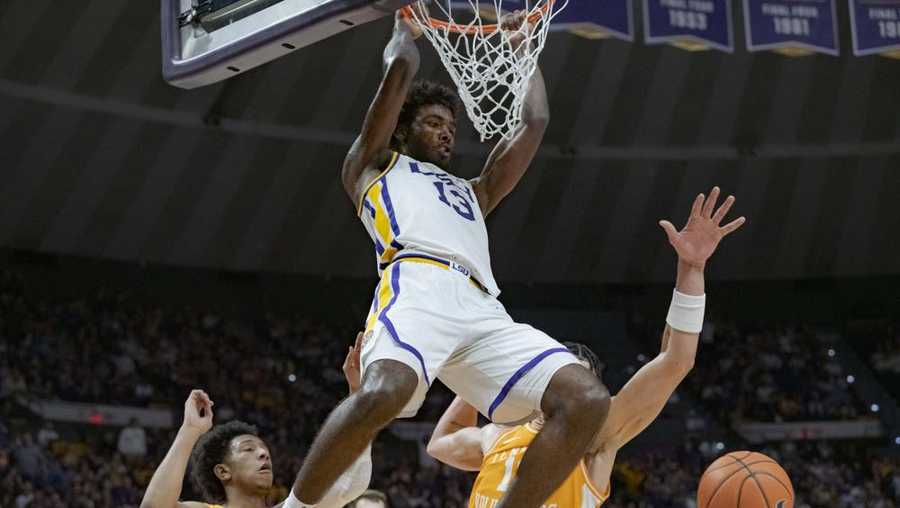 lsu forward tari eason (13) dunks against tennessee forward olivier nkamhoua, left, and guard kennedy chandler (1) during the second half of an ncaa college basketball game in baton rouge, la., saturday, jan. 8, 2022. (ap photo/matthew hinton)