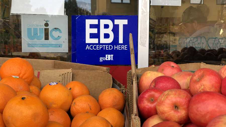 A sign noting the acceptance of electronic benefit transfer (EBT) cards that are used by state welfare departments to issue benefits is displayed at a grocery store on December 04, 2019 in Oakland, California.