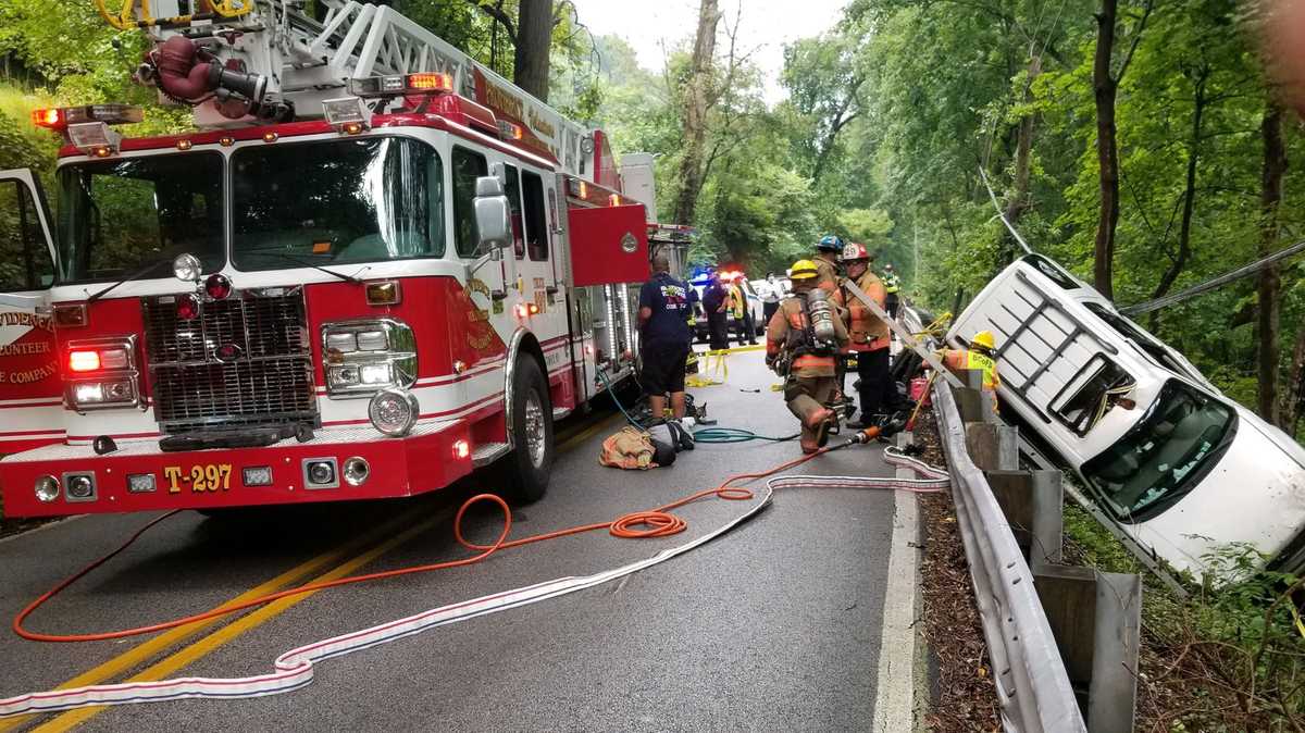 Driver being rescued after crashing over embankment in Parkville