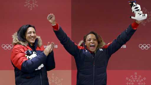 Driver Elana Meyers Taylor, left, and Lauren Gibbs, right, of the United States celebrate winning the silver medal during the women's two-man bobsled final at the 2018 Winter Olympics in Pyeongchang, South Korea, Wednesday, Feb. 21, 2018. 