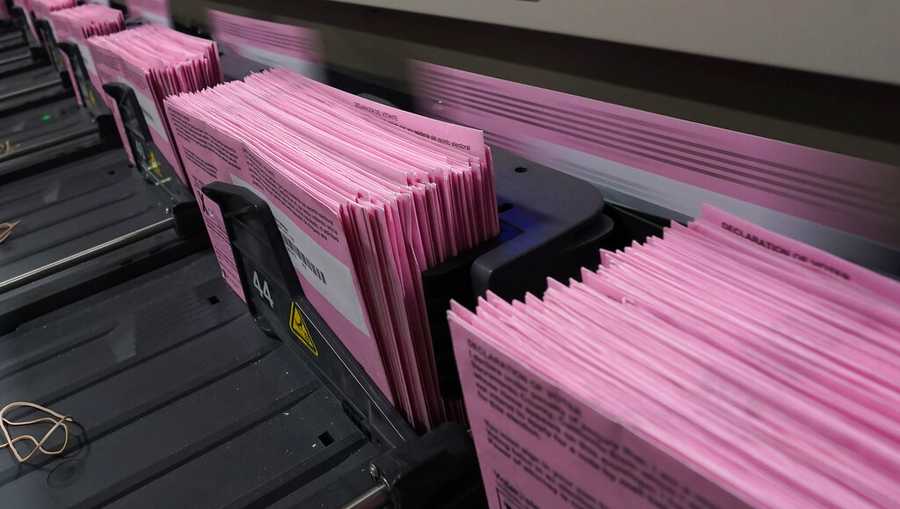 Mail in ballots run through a sorting machine at the Sacramento County Registrar of Voters office in Sacramento, Calif., Monday, Aug. 30, 2021. California voters have until Sept. 14 to cast their ballots to either keep Gov. Gavin Newsom in office are replace him with one of over 40 candidates on the recall ballot. In a state dominated by Democrats the outcome will depend on who takes the time to vote. (AP Photo/Rich Pedroncelli)