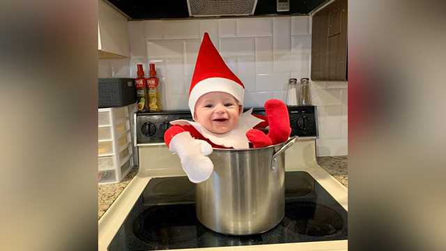 Baby dresses up as The Elf on the Shelf