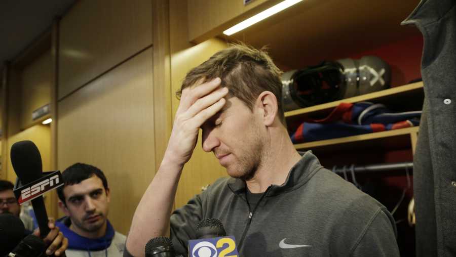 New York Giants quarterback Eli Manning gestures while speaking to reporters in the locker room in East Rutherford, N.J., Monday, Jan. 9, 2017.