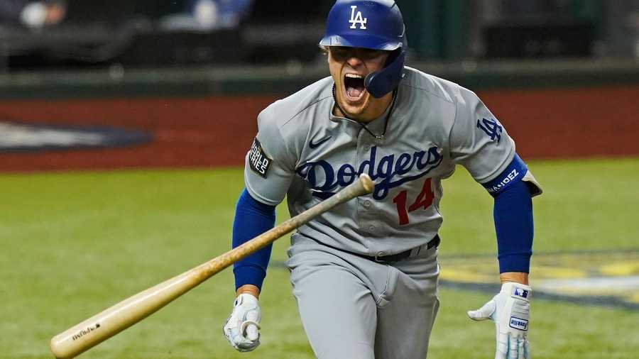 Los Angeles Dodgers' Enrique Hernandez celebrates a RBI-double against the Tampa Bay Rays during the sixth inning in Game 4 of the baseball World Series Saturday, Oct. 24, 2020, in Arlington, Texas. (AP Photo)