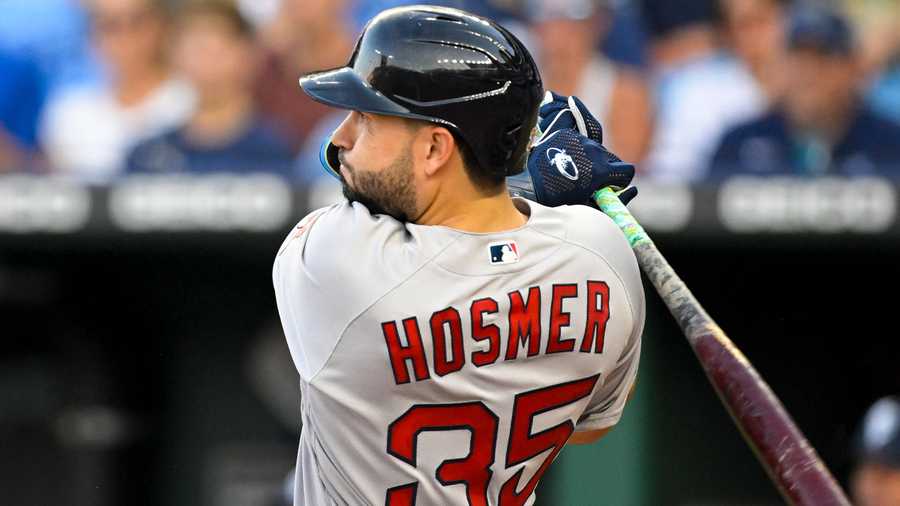 Boston Red Sox's Eric Hosmer follows through on an RBI double during the second inning of the team's baseball against the Kansas City Royals, Friday, Aug. 5, 2022, in Kansas City, Mo.