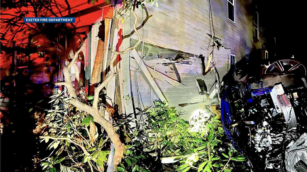 Several displaced after car crashes into NH home, authorities say