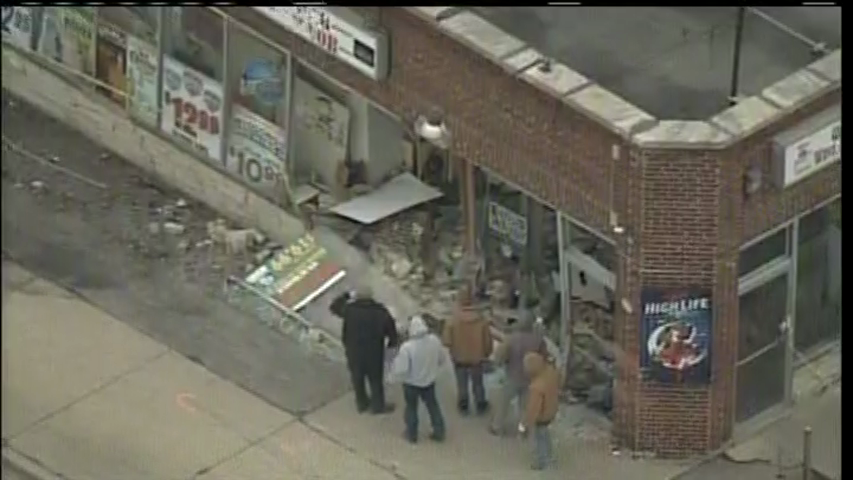 Car slams into liquor store