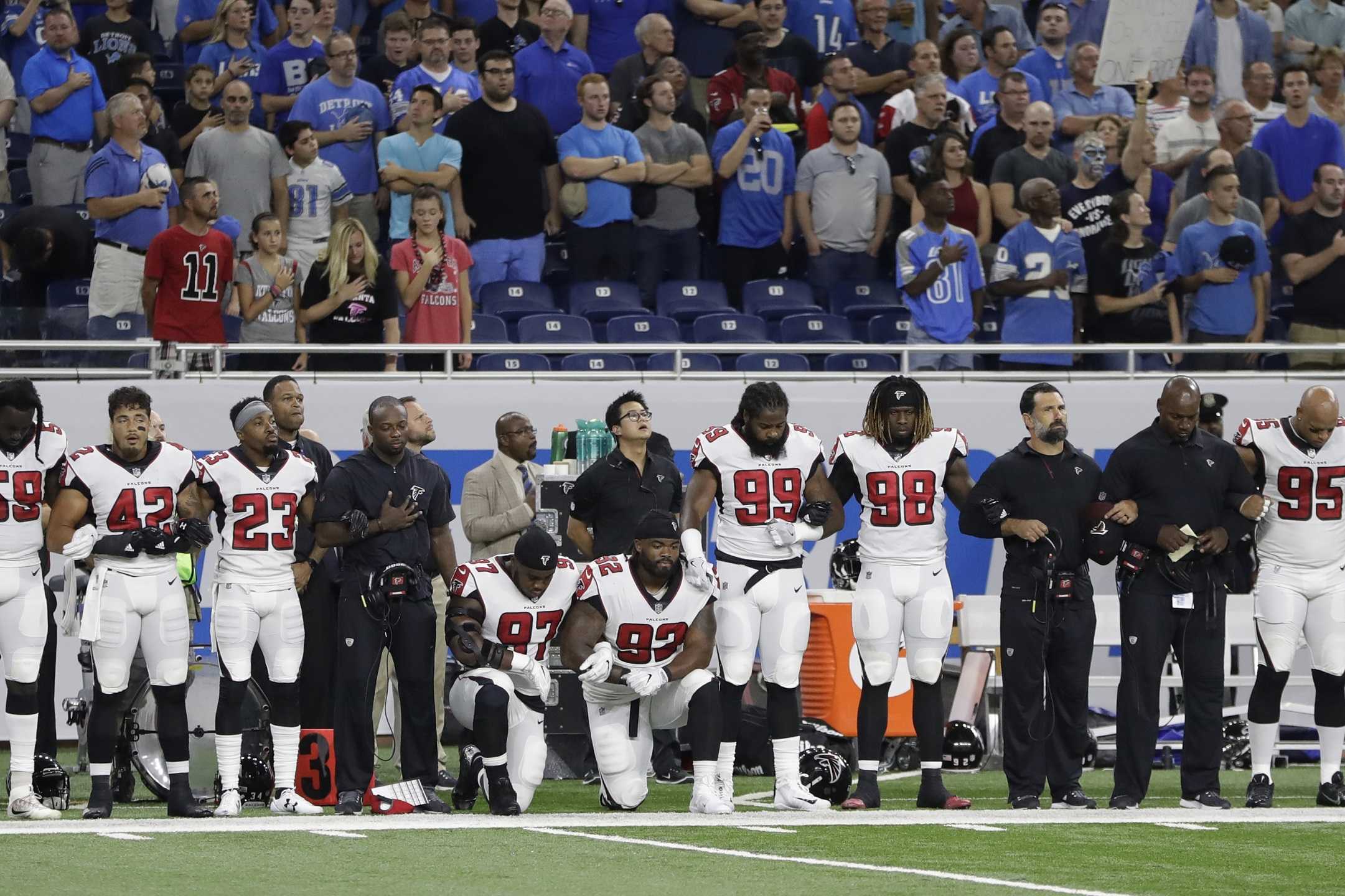 PHOTOS: NFL Players Kneel To Protest Trump's Remarks