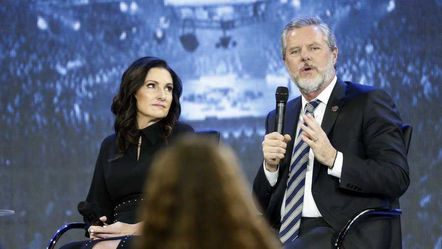 In this Wednesday, Nov. 28, 2018 file photo, Jerry Falwell Jr., right, answers a student's question, accompanied by his wife, Becki, during a town hall meeting on the opioid crisis at a convocation at Liberty University in Lynchburg, Va.