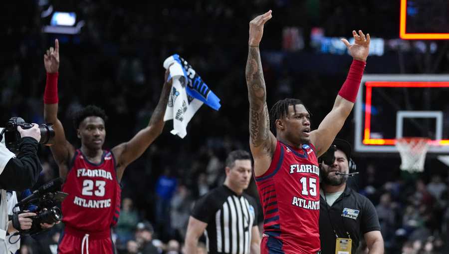 FAU basketball Florida Atlantic guard Alijah Martin (15) and guard Brandon Weatherspoon (23) celebrate after defeating Memphis 66-65 in a first-round college basketball game in the men's NCAA Tournament in Columbus, Ohio, Friday, March 17, 2023.
