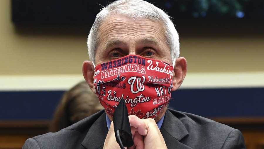 FILE- In this June 23, 2020 photo, Director of the National Institute of Allergy and Infectious Diseases Dr. Anthony Fauci wears a face mask as he waits to testify before a House Committee on Energy and Commerce on the Trump administration's response to the COVID-19 pandemic on Capitol Hill in Washington.