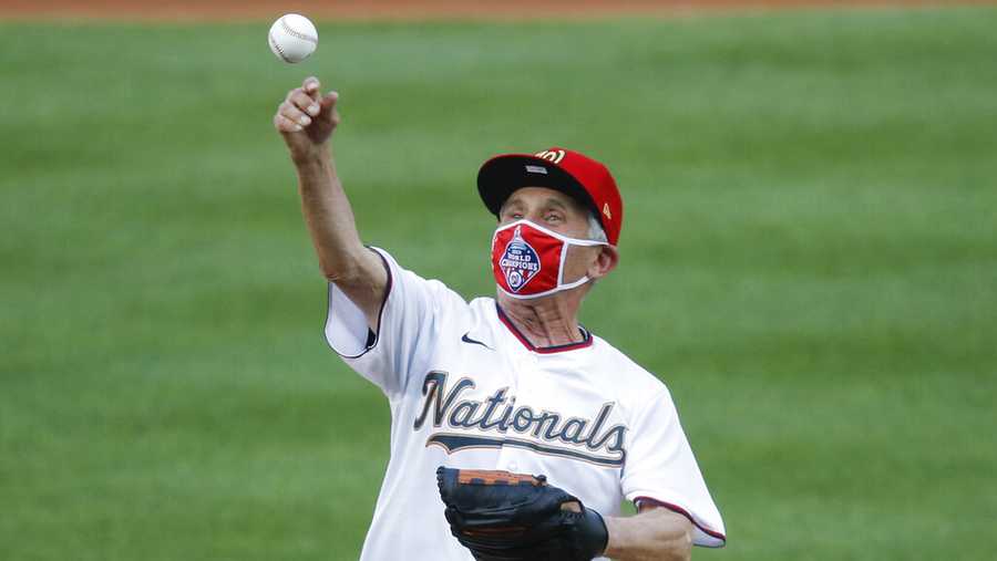 Ceremonial first pitch is thrown by Dr. Anthony Fauci, director of the National Institute of Allergy and Infectious Diseases, before the start of the during the first inning of an opening day baseball game between the New York Yankees and Washington Nationals at Nationals Park, Thursday, July 23, 2020, in Washington.