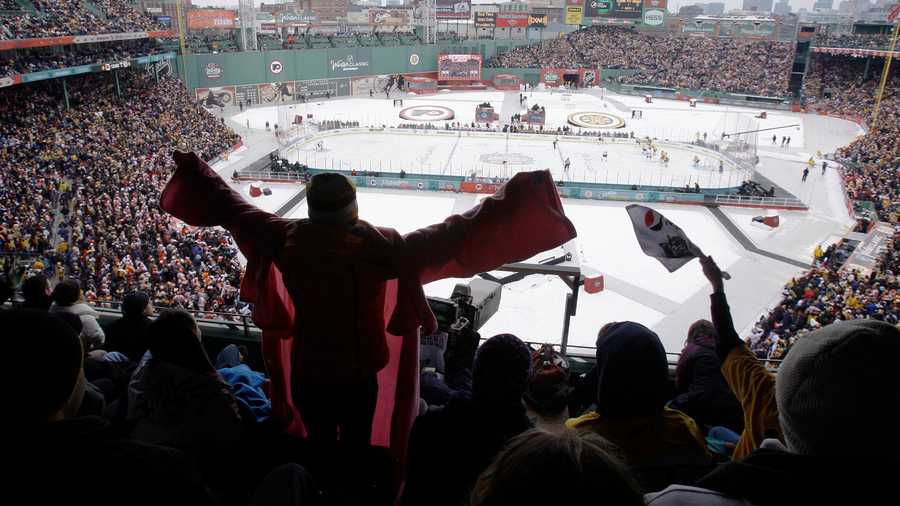 Fans cheer during the first period of the New Year's Day Winter Classic NHL hockey game between the Philadelphia Flyers and Boston Bruins at Fenway Park in Boston, Friday, Jan. 1, 2010.