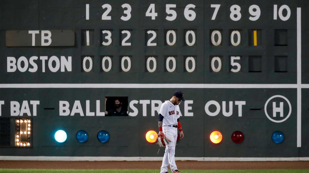 A baseball landed in a scoreboard light on Fenway Park's Green Monster
