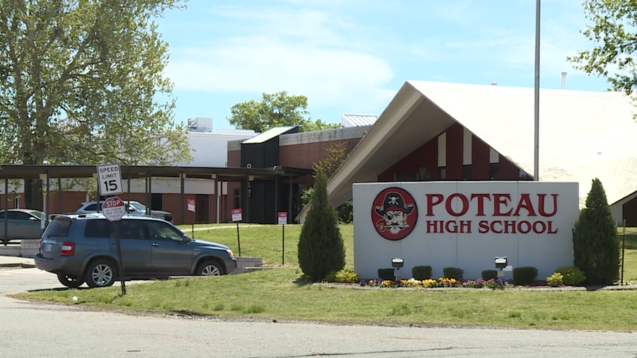 Exterior photo of Poteau High School with the Pirates mascot on the sign.