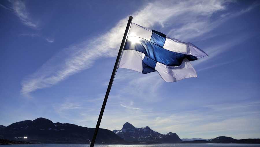 In this Saturday, July 29, 2017 file photo, Finland's flag flies aboard the Finnish icebreaker MSV Nordica as it arrives into Nuuk, Greenland. Finland has come out on top of an international index that ranks nations by how happy they are as places to live. The World Happiness Report 2018 published Wednesday, March 14, 2018 ranked 156 countries by their happiness levels, based on factors such as life expectancy, social support and corruption. Unlike past years, the annual report published by the United Nations Sustainable Development Solutions Network also evaluated 117 countries by the happiness of their immigrants.