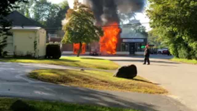 Heavy flames tear through Wayland commercial building - Vimarsana News