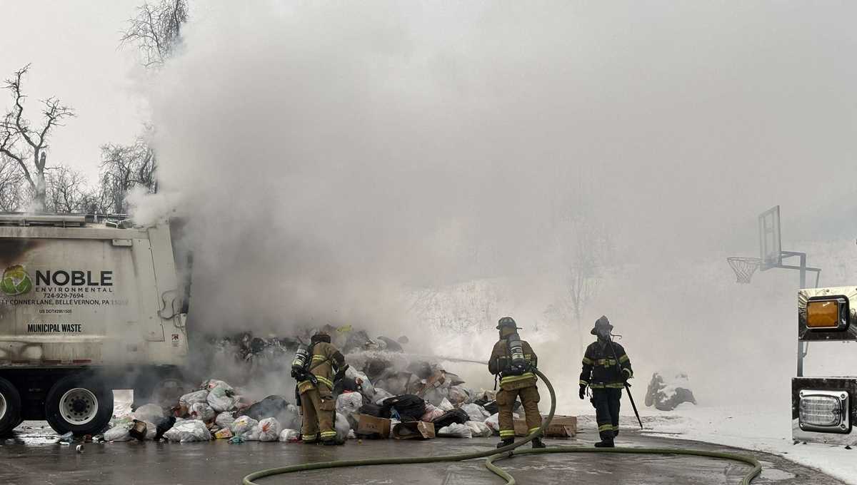 Fire crews extinguish flames after garbage truck catches fire in ...