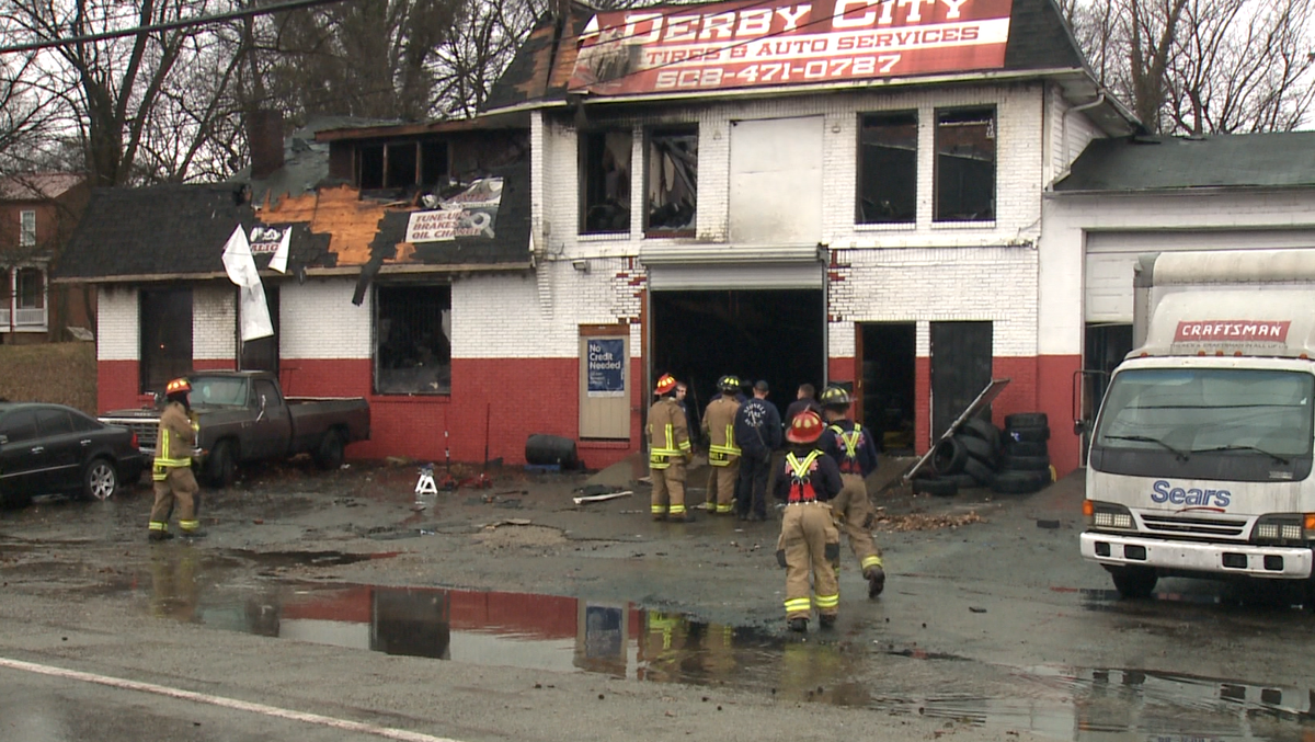 Dozens of firefighters battle fire at auto shop in Shively