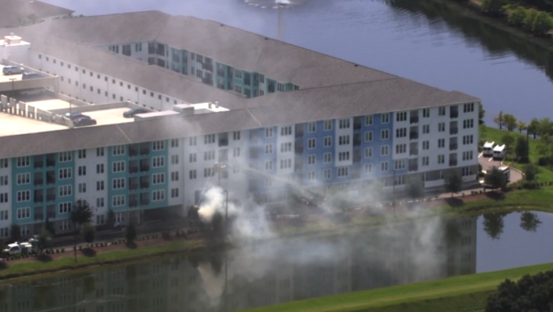 Garbage truck catches fire at Orlando apartment complex