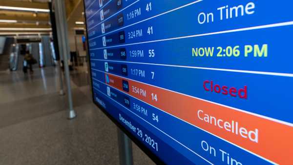 A flight shows canceled on the departures board at Ronald Reagan Washington National Airport, Wednesday, Dec. 29, 2021, in Arlington, Va.